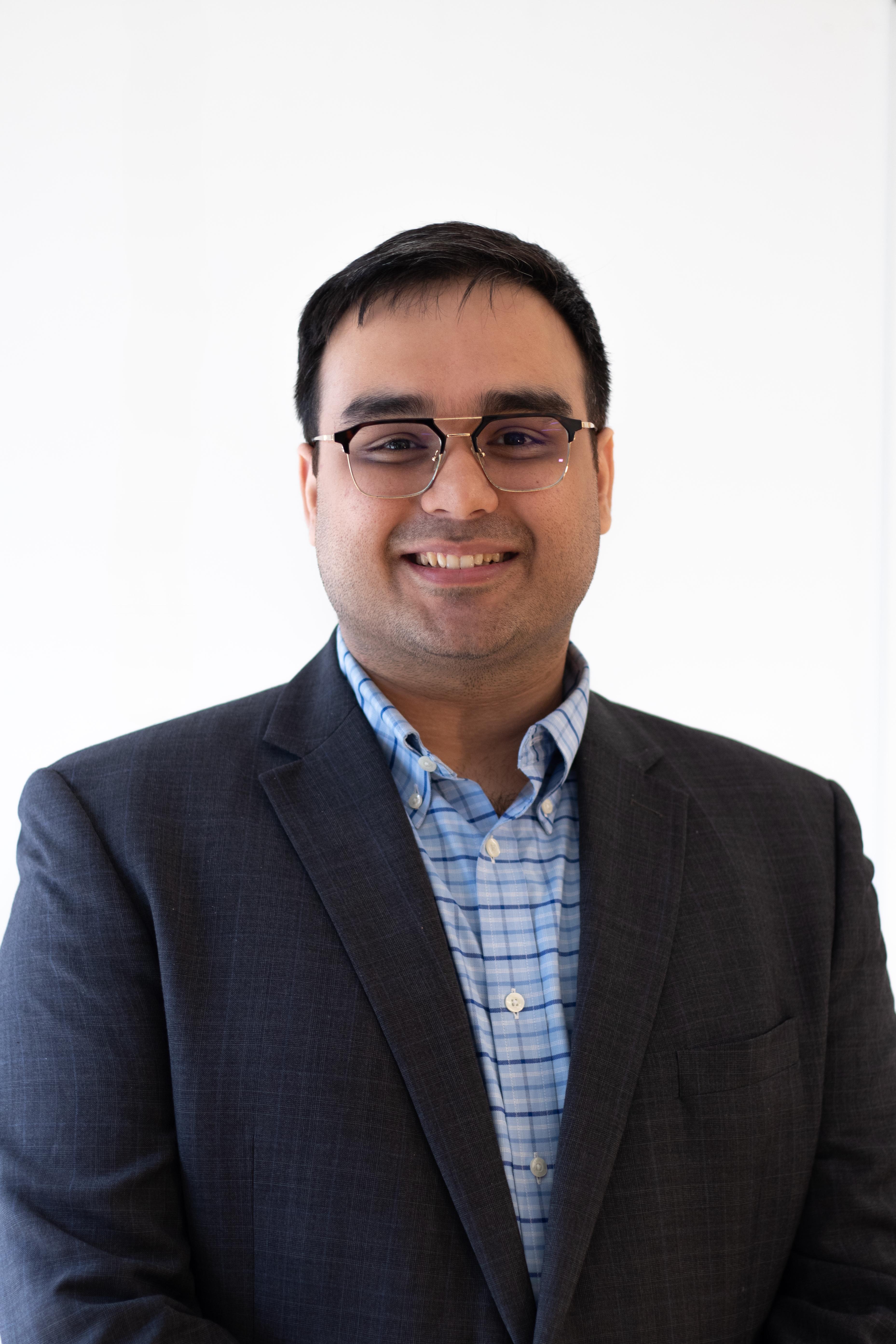 Headshot of Advait looking into the camera